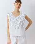 Front view of Yaccomaricard Hane Vest in white featuring textured cotton lawn ribbon embellishment.