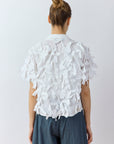 Back view of Yaccomaricard Hane Shirt in white highlighting the bias-cut cotton ribbon plumage.