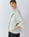 Side profile of the Faneru Jersey Jacket in Cool Grey showing the relaxed A-line swing silhouette.