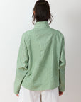 Back view of Powder Green Shibo Jacket showing relaxed fit and quilting-inspired smocking detail.
