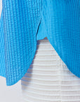 Detail shot of the premium textured cotton and pintuck stitching in Hana Blue.
