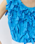 Close-up of lawn ribbon texture on Hane Vest by Yaccomaricard, cotton fabric detail.