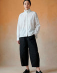 Model wearing Yaccomaricard Obaru Trouser in Black – Relaxed Japanese designer styling.