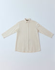 Flat lay of Yaccomaricard Cotton Jersey + Lawn A-line Overshirt in Jasmine White showing the different textures.