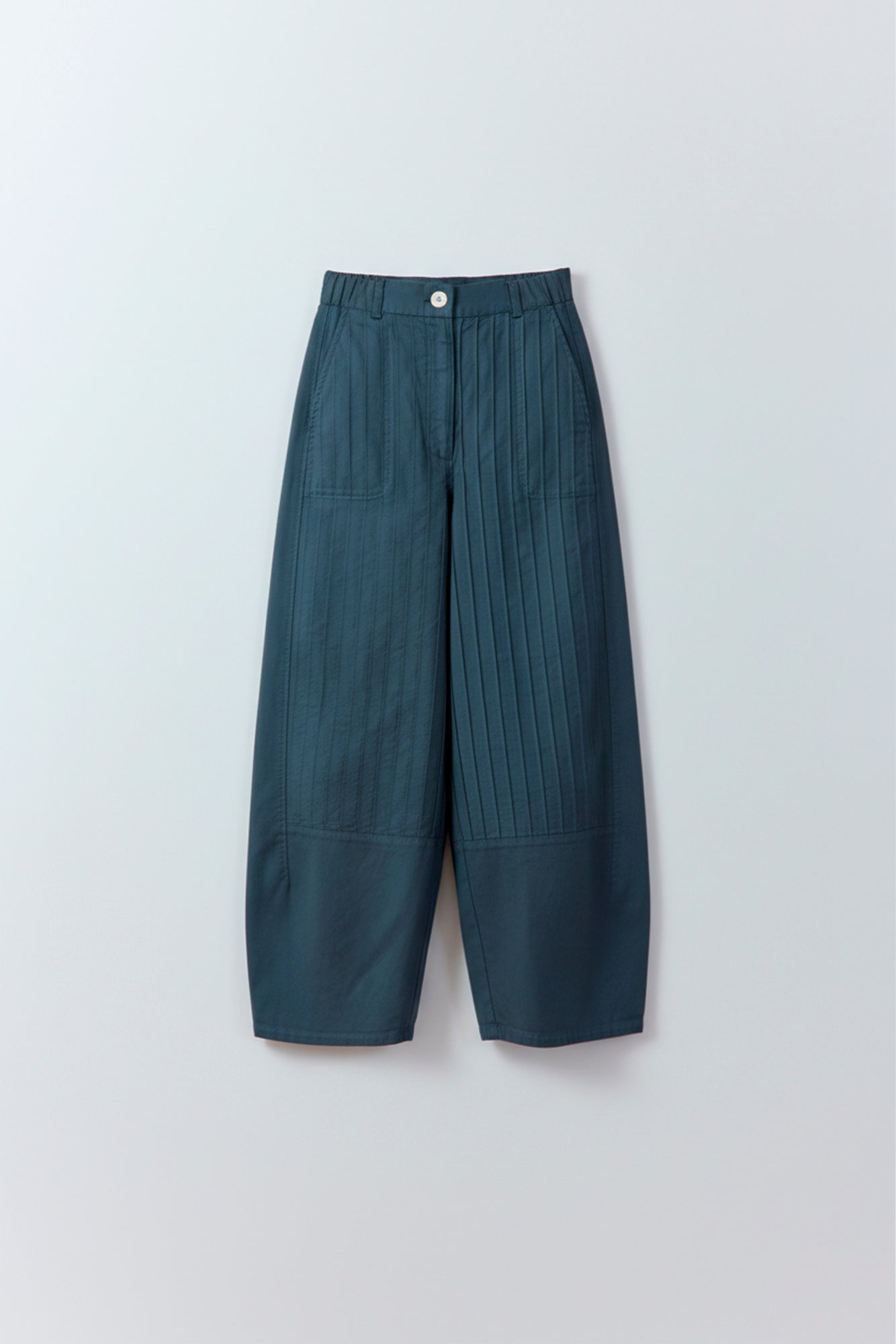 Flat lay of Yaccomaricard Obaru Trouser in Stone Blue showing the garment-dyed textured cotton.