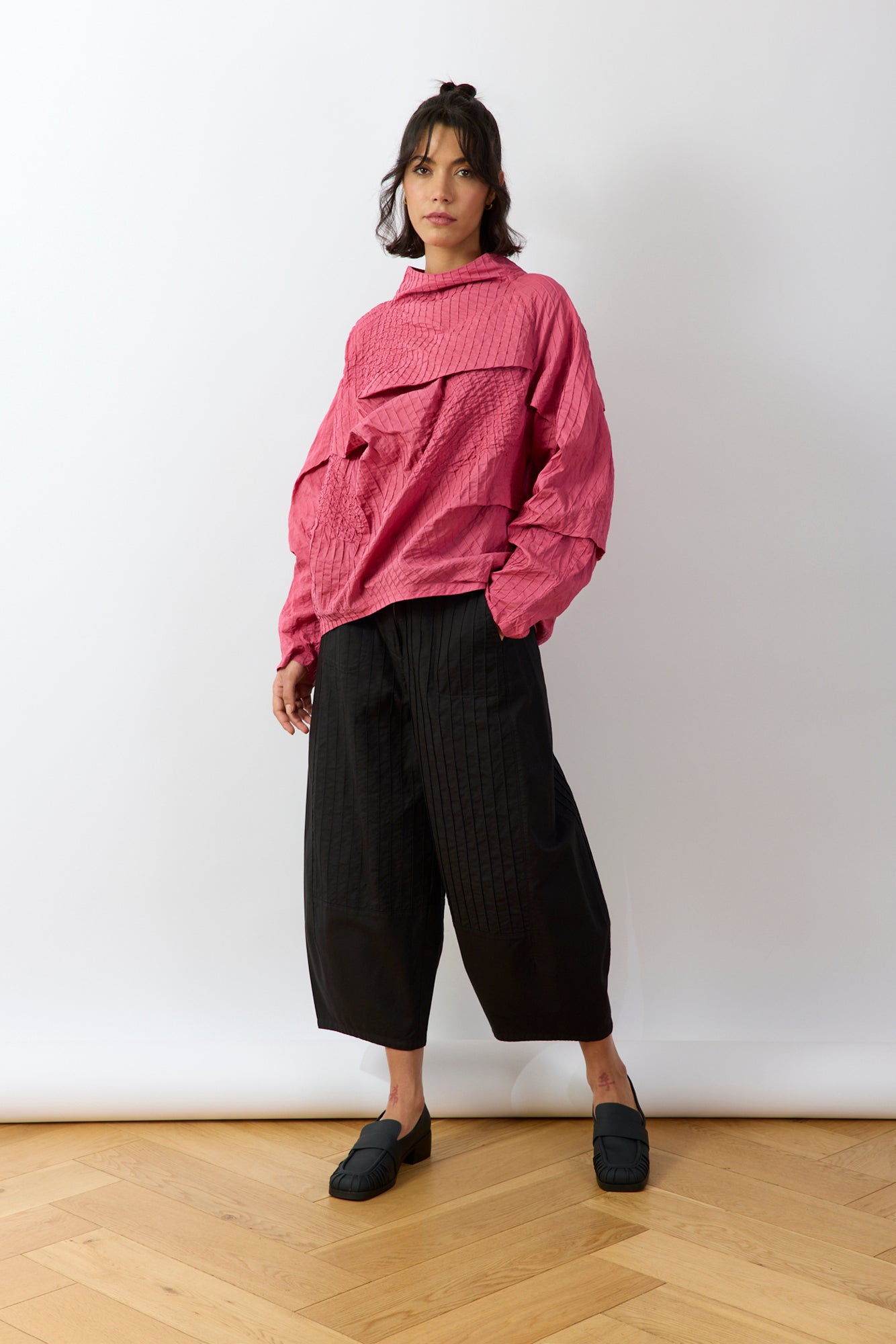 Model wearing Shibo Top in Dust Rose by Yaccomaricard, an outfit that feels as comfortable as it looks considered, offering a modern, flattering fit.