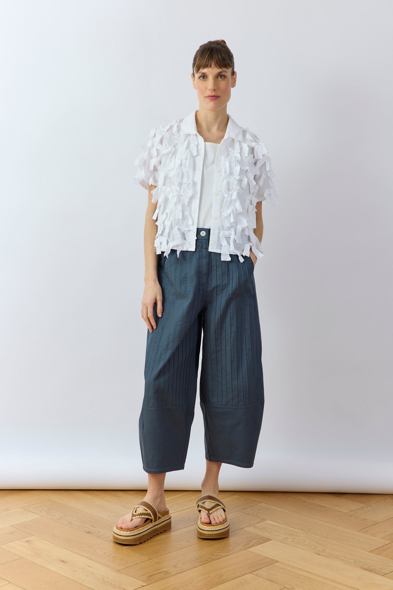 Model wearing White Hane Shirt by Yaccomaricard featuring textured lawn ribbon surface.