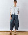 Model wearing White Hane Shirt by Yaccomaricard featuring textured lawn ribbon surface.
