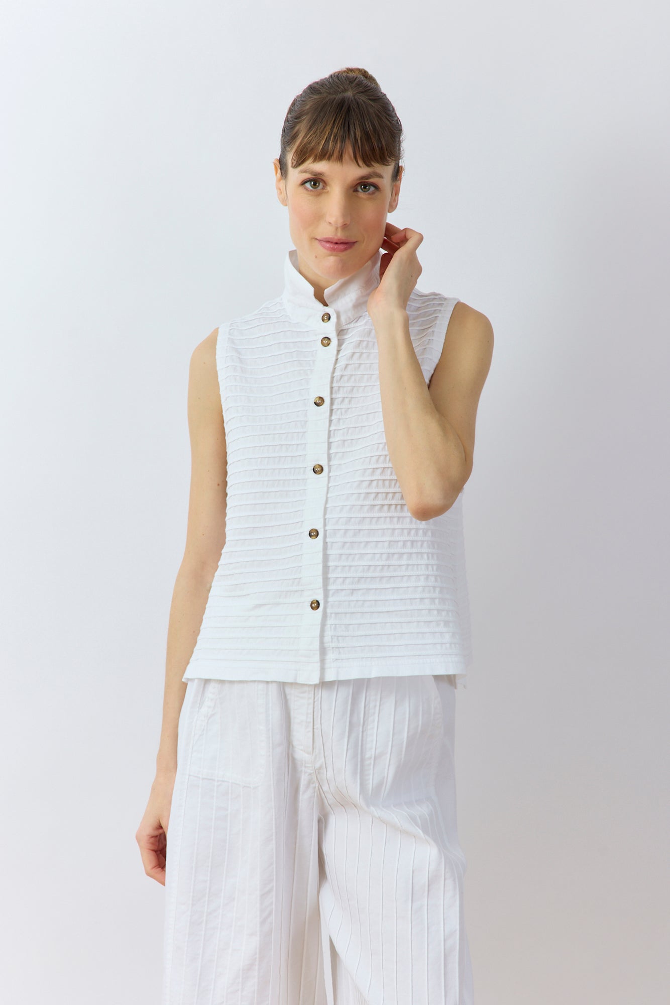 Front view of Kantan Jersey Waistcoat in white by Yaccomaricard showing casual layering.