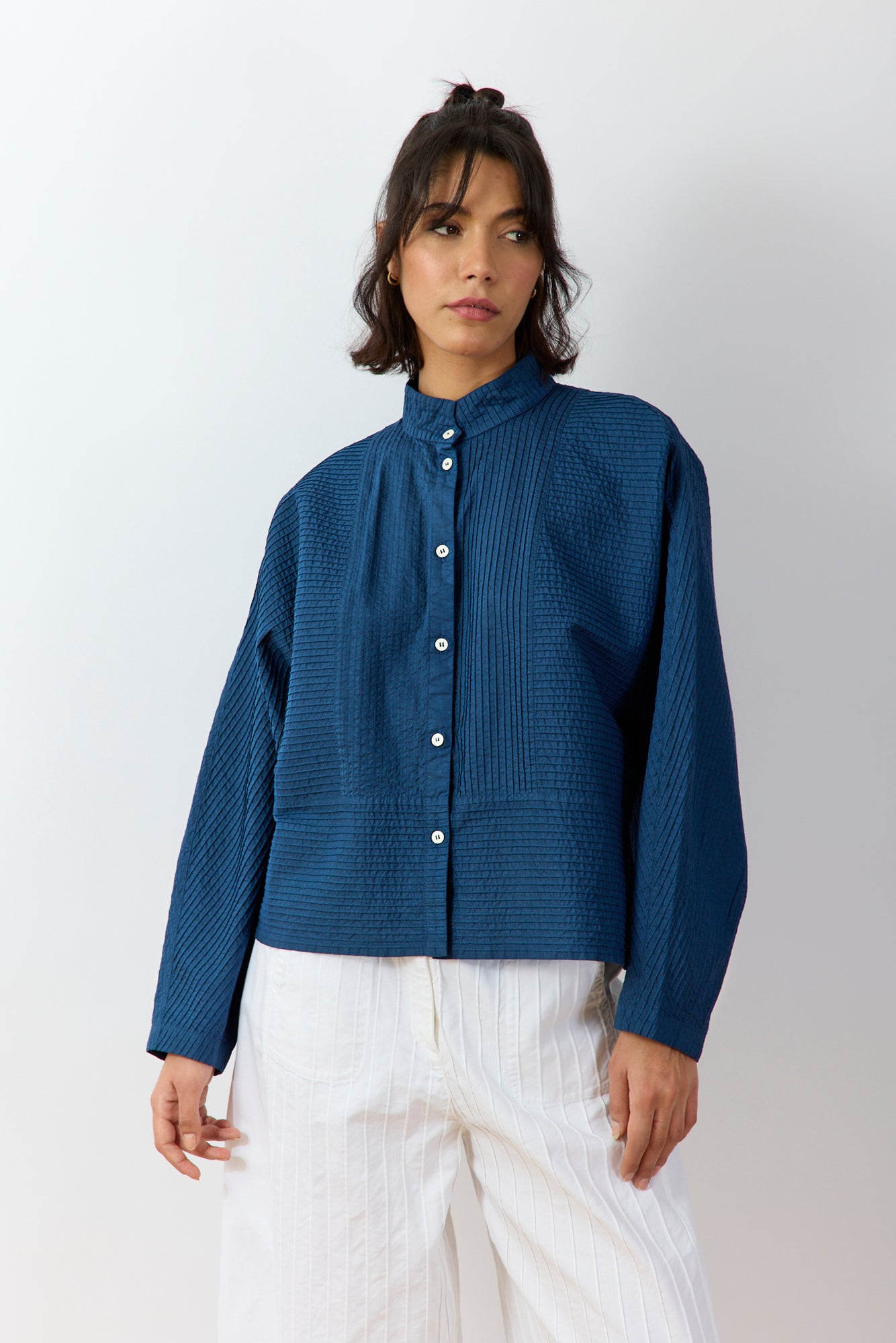 Front view of Bibbu Shirt in agate blue by Yaccomaricard London with pintuck panel detailing on cotton lawn.
