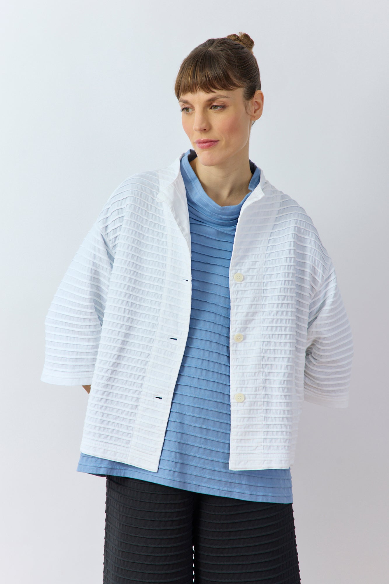 Front view of Yaccomaricard Faneru Jersey open Jacket in white showing pintuck work.