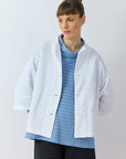 Front view of Yaccomaricard Faneru Jersey open Jacket in white showing pintuck work.