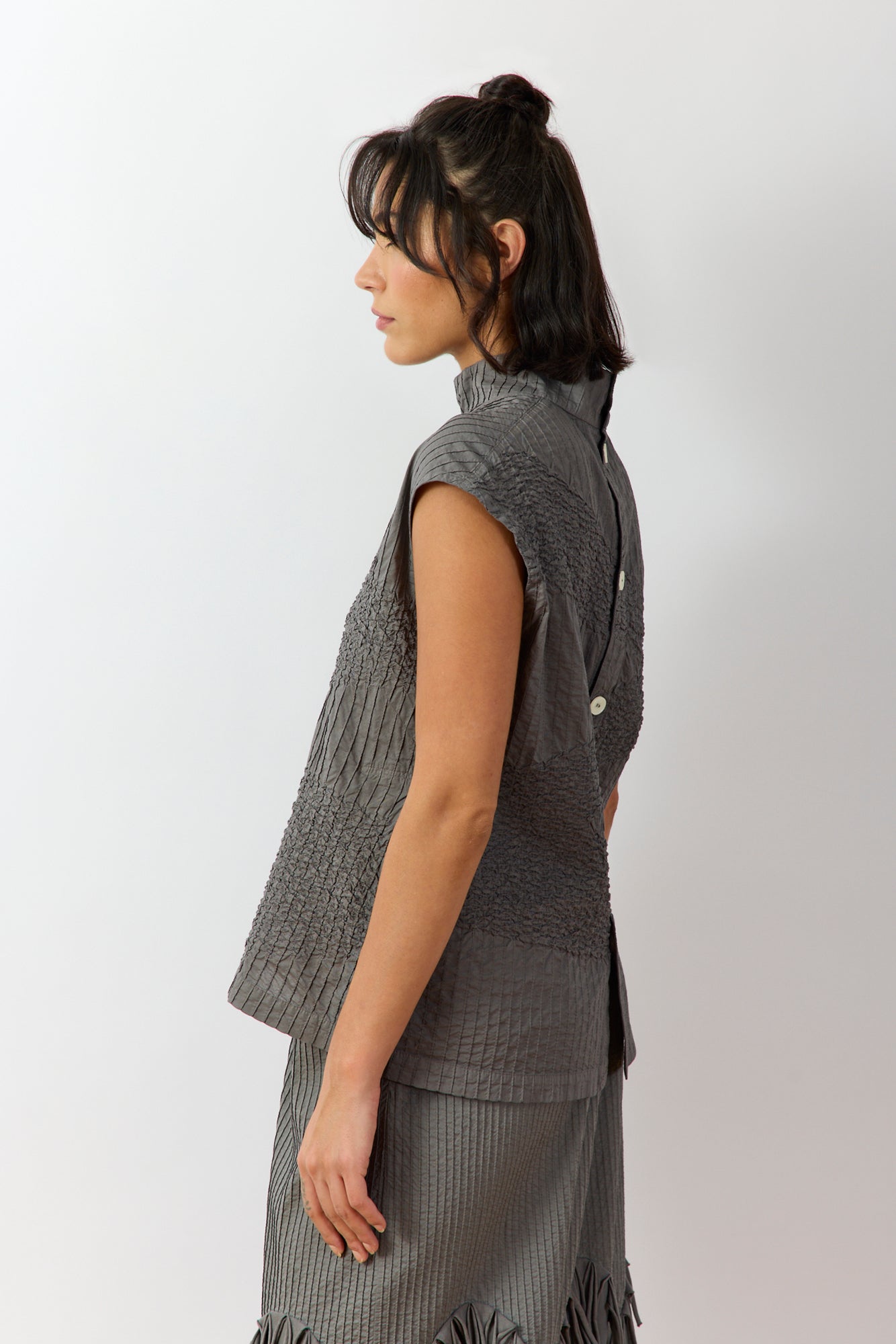 Side view of Shibo Shell Top in Ash highlighting off-body fit and grown-on sleeve silhouette.