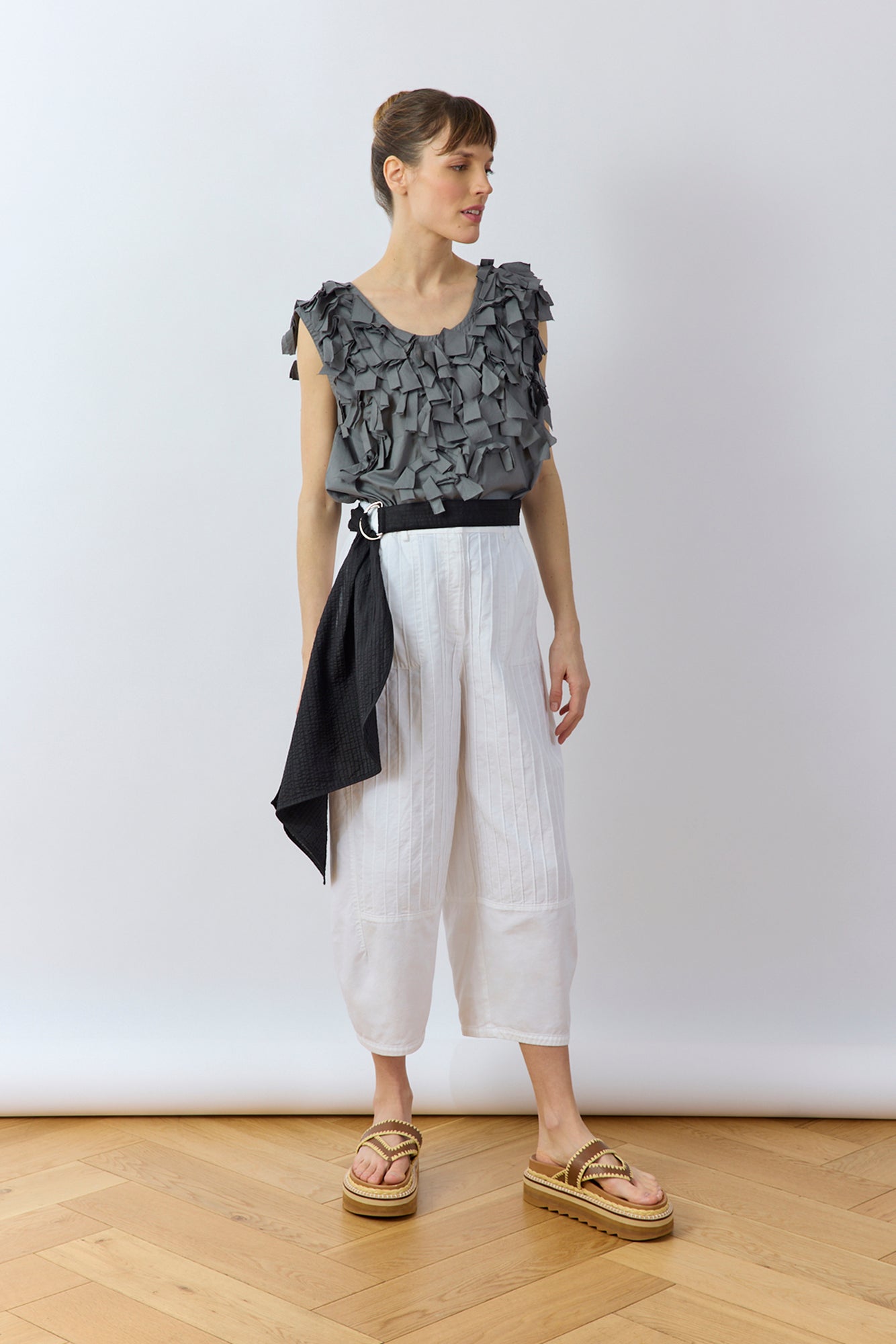 Model wearing YaccoMaricard Sukafu Belt in Black showing the cotton pintuck design.