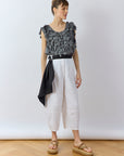 Model wearing YaccoMaricard Sukafu Belt in Black showing the cotton pintuck design.