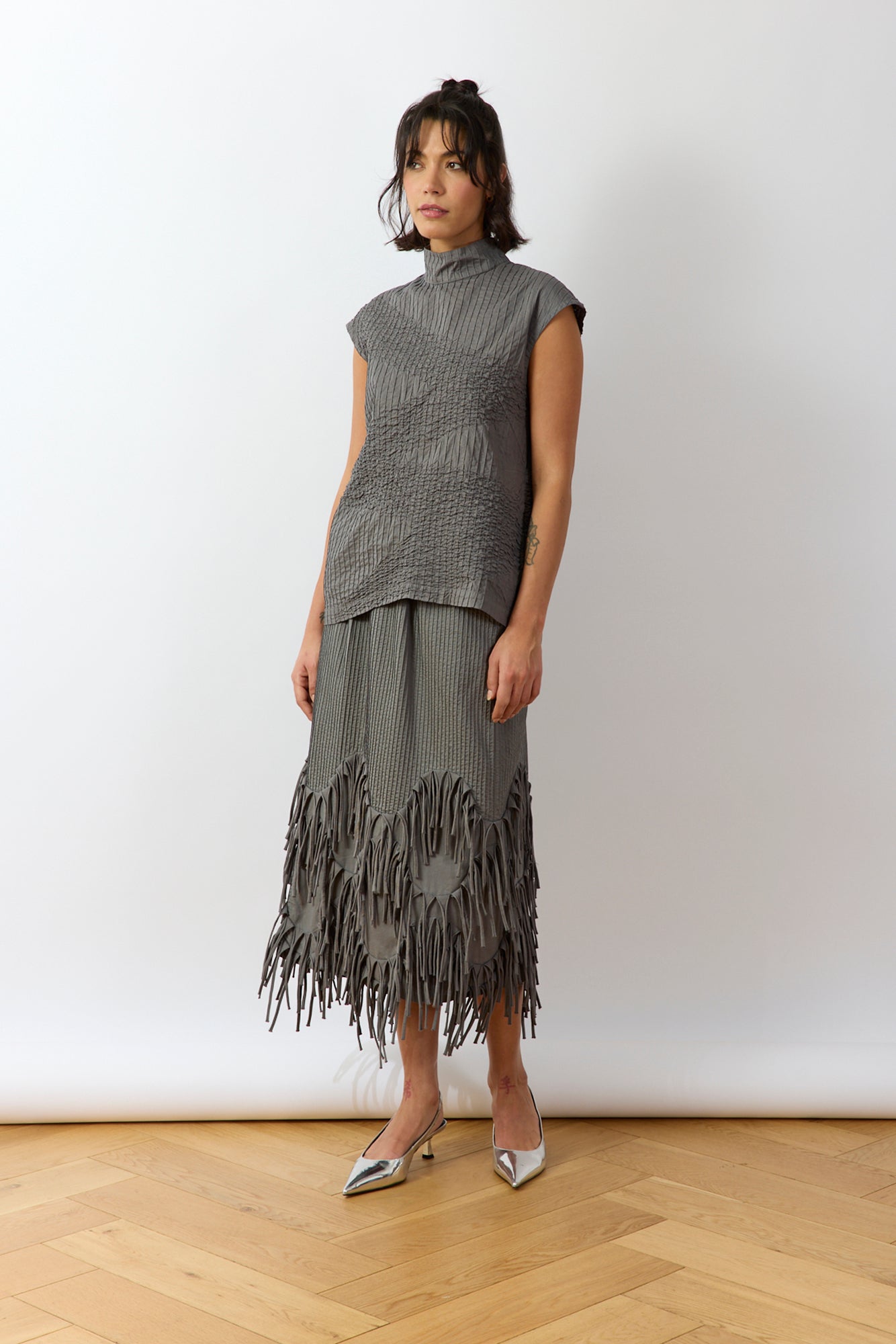 Model wearing Ash Shibo Shell Top styled casually, showing relaxed fit and drape.