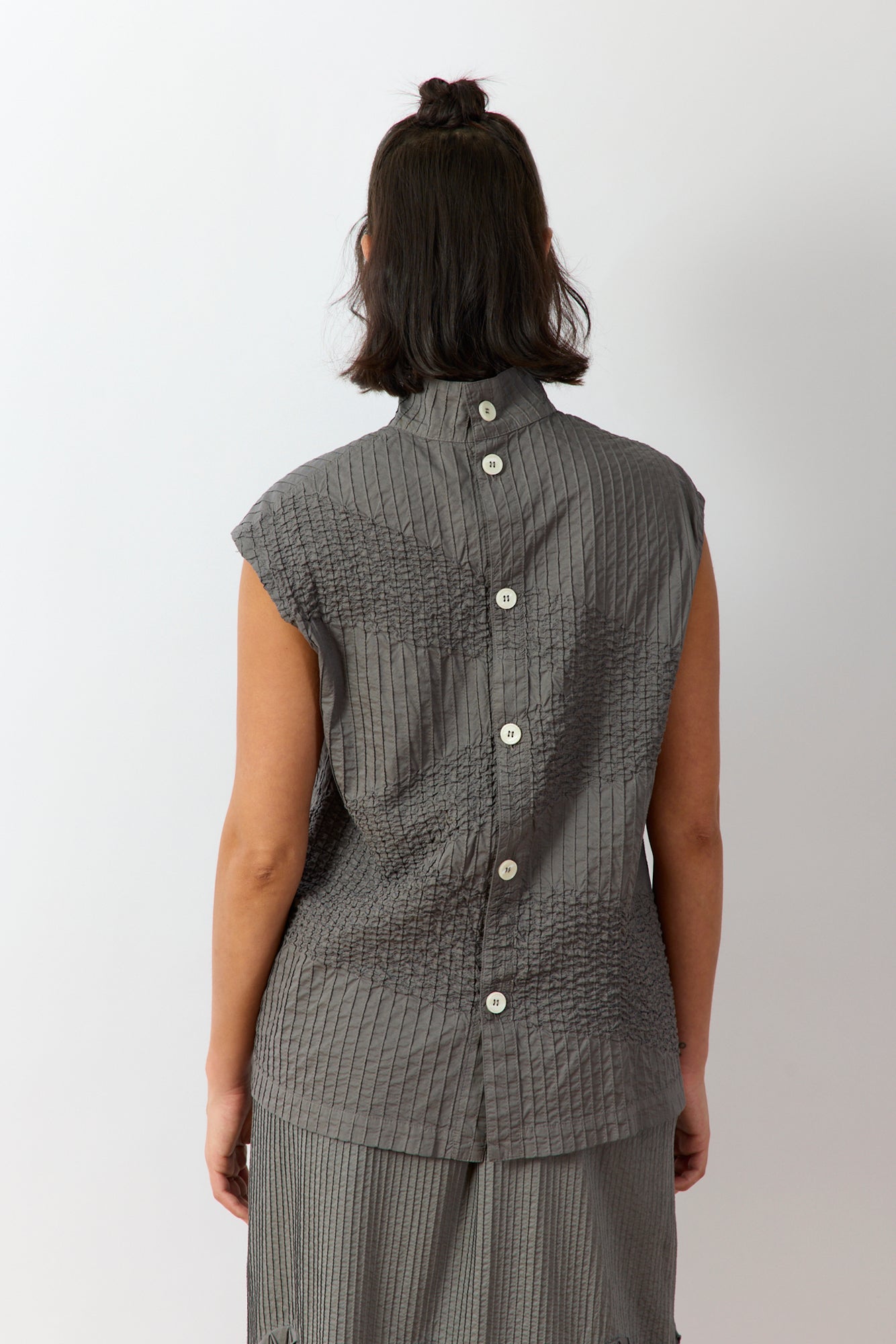 Back view of Ash Shibo Shell Top showing full back button-through and sculptural shape.