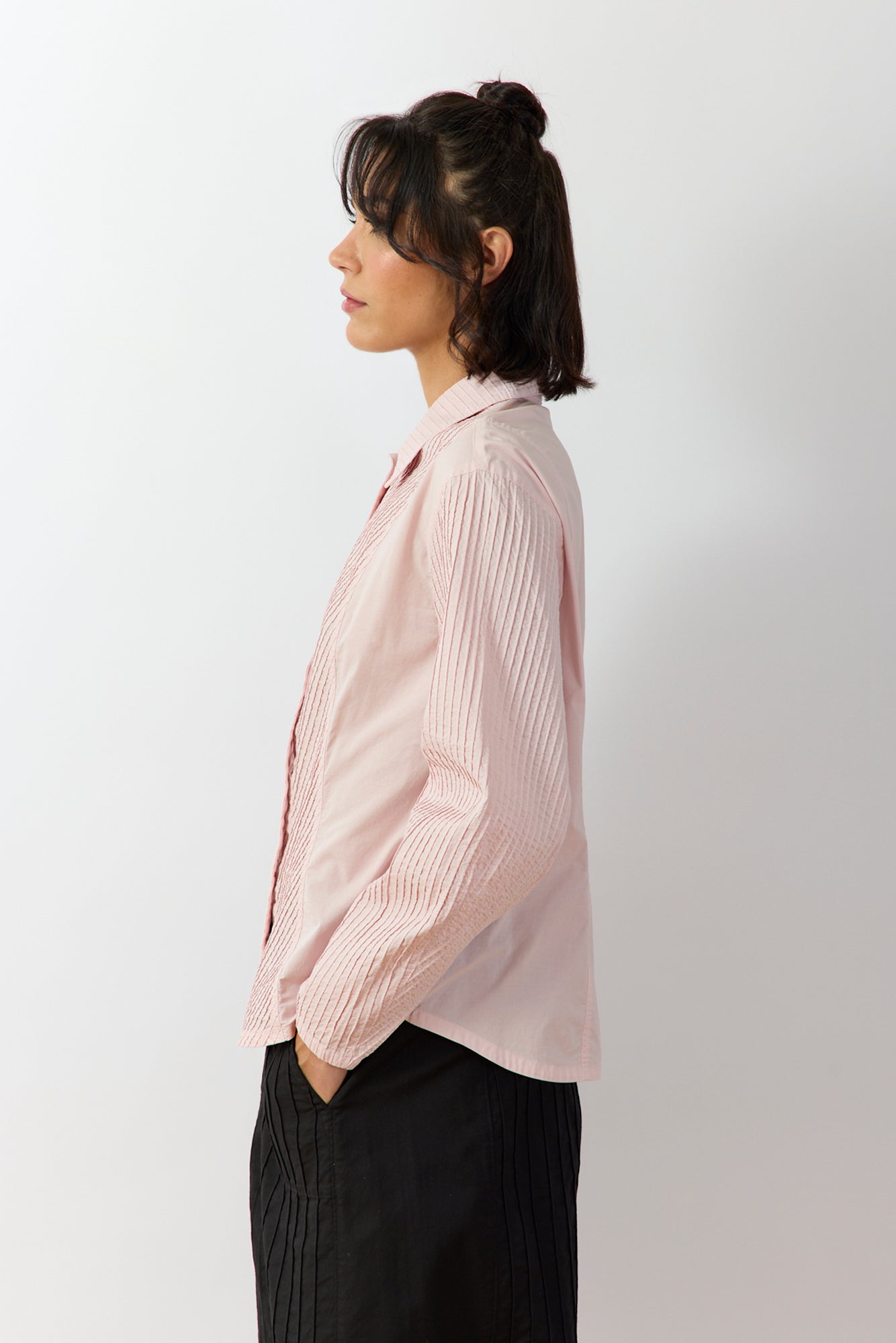 Side profile of the Sakura Wanda Shirt showing the softly curved seams and elegant fluid silhouette.