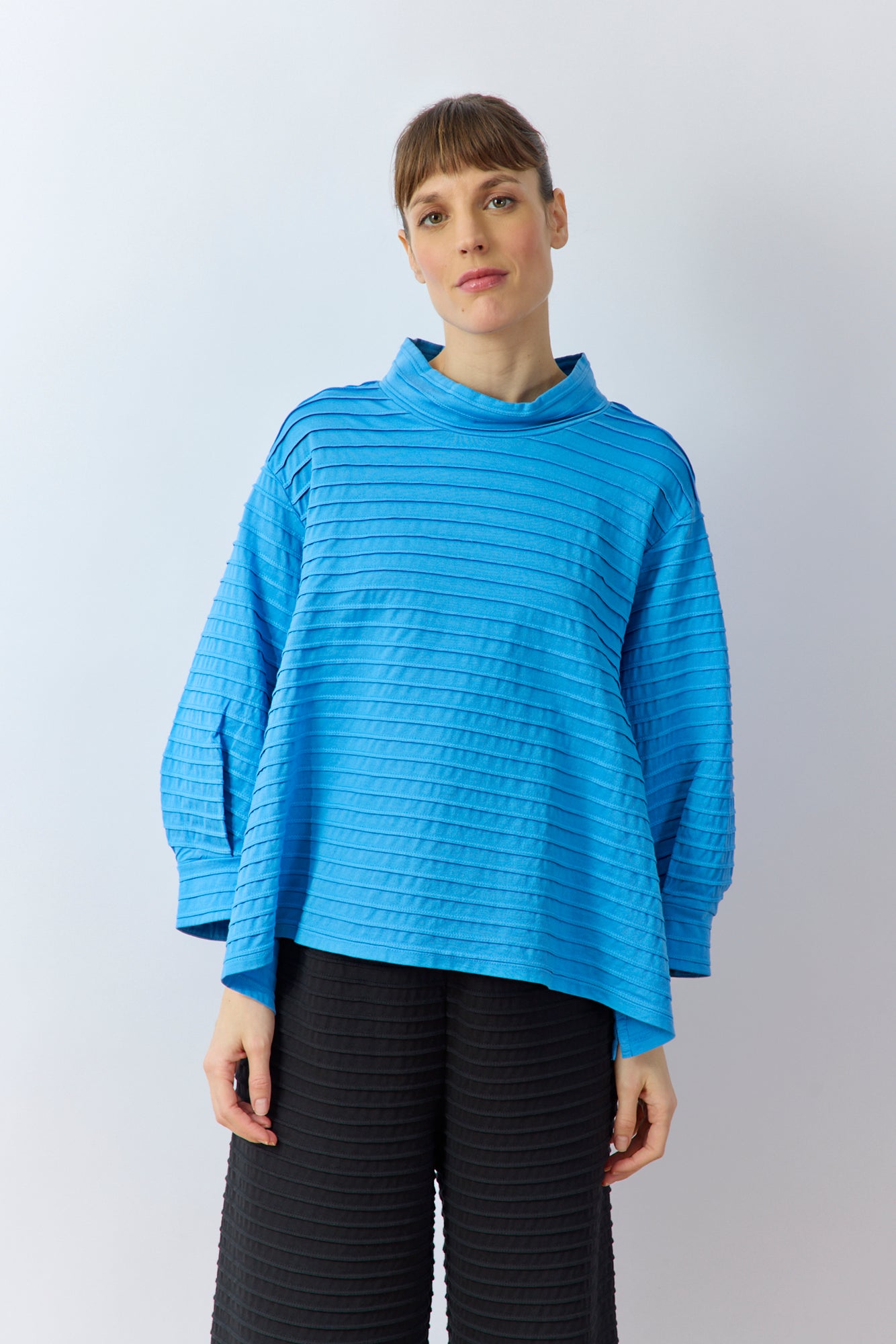 Yaccomaricard Spring Summer 26 Sode jersey pullover in Hana blue with horizontal pintucks.