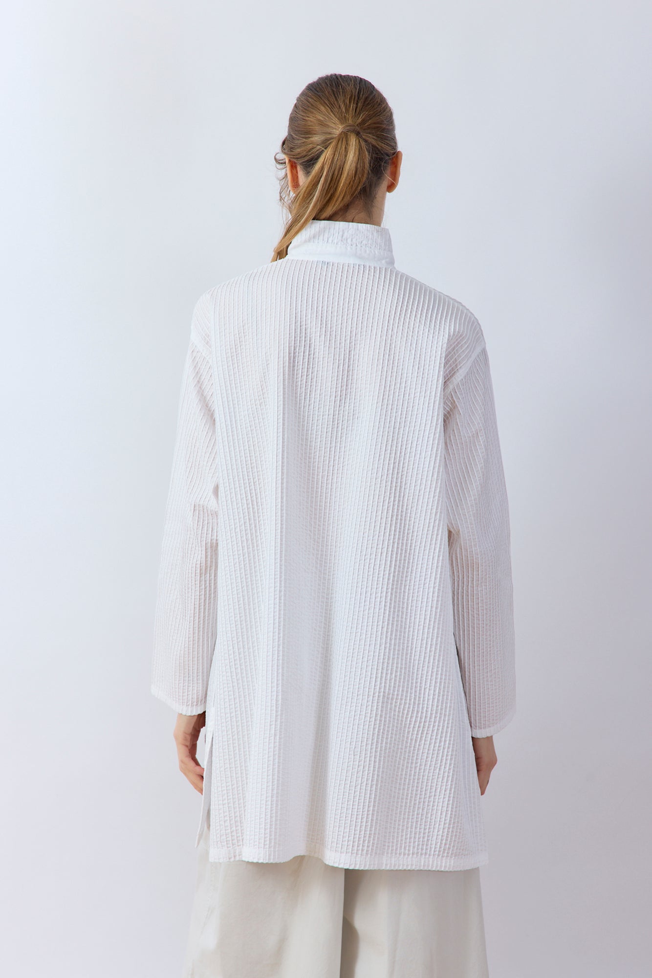 Back view of Yaccomaricard Classic Tunic Shirt highlighting the flattering pintuck cotton lawn texture.