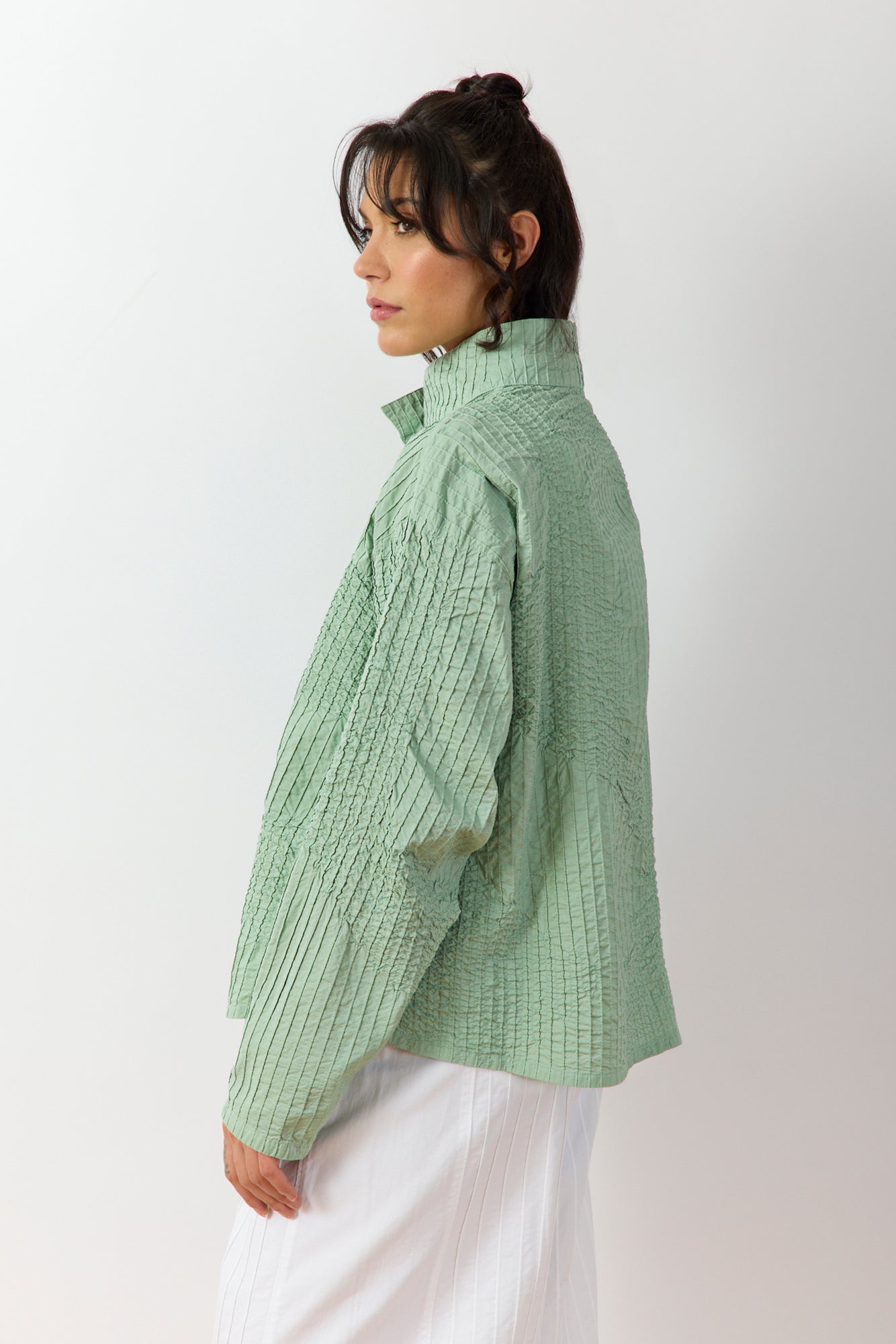 Side view of Powder  Green Shibo Jacket highlighting silhouette and gathered cotton texture.