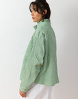 Side view of Powder  Green Shibo Jacket highlighting silhouette and gathered cotton texture.