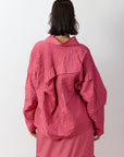 Back view of the Yaccomaricard pintuck Shibo top, highlighting the consistent texture of the pintucks across the shoulders and the clean, minimalist finish of the hem