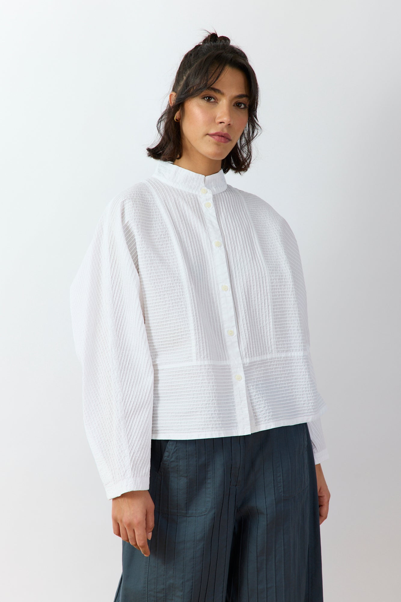 Front view of Bibbu Shirt in white by Yaccomaricard London, oversized cotton lawn shirt with pintuck panel detailing.