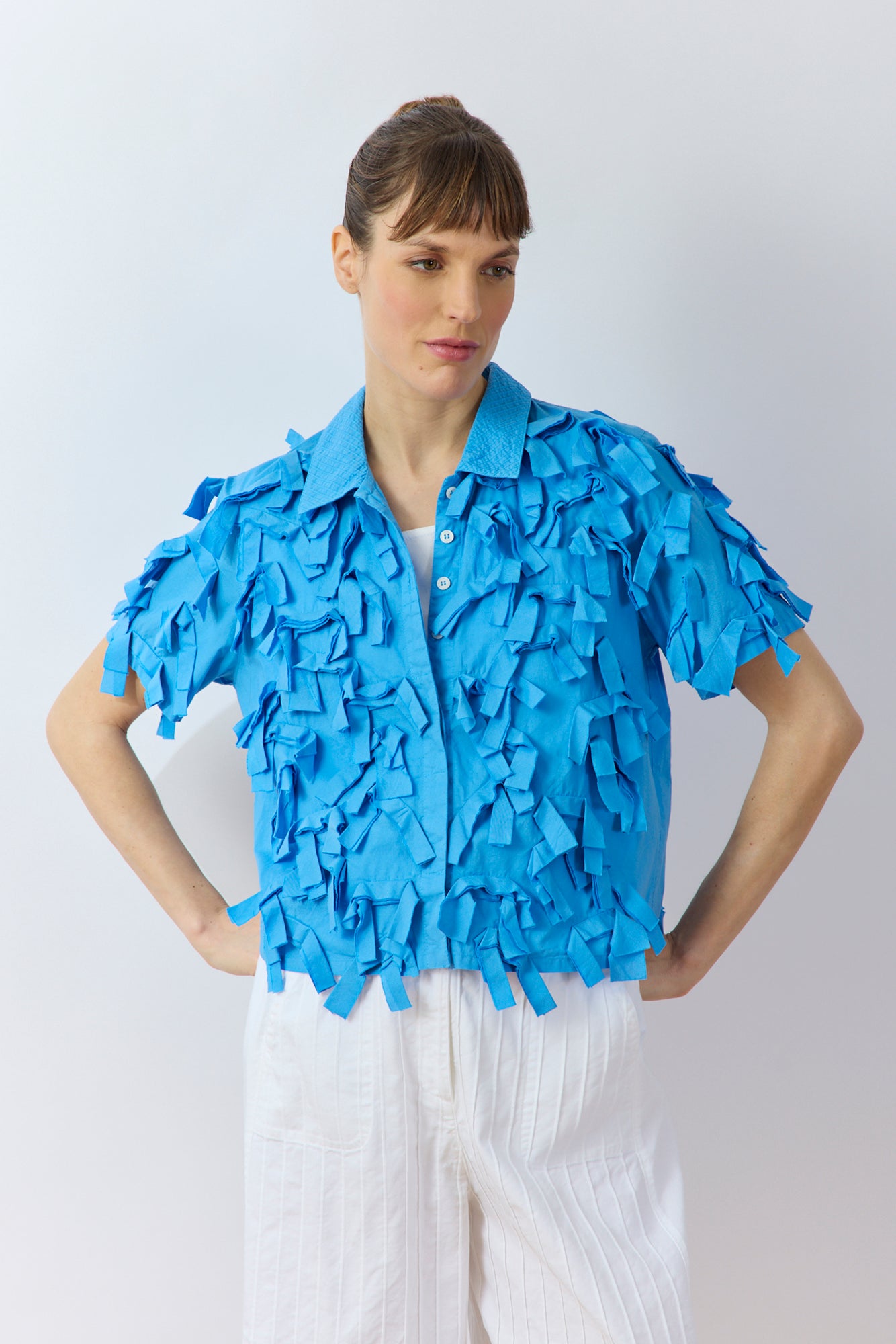 Front view of Yaccomaricard Hane Shirt in Hana Blue with ribbon texture and casual silhouette.