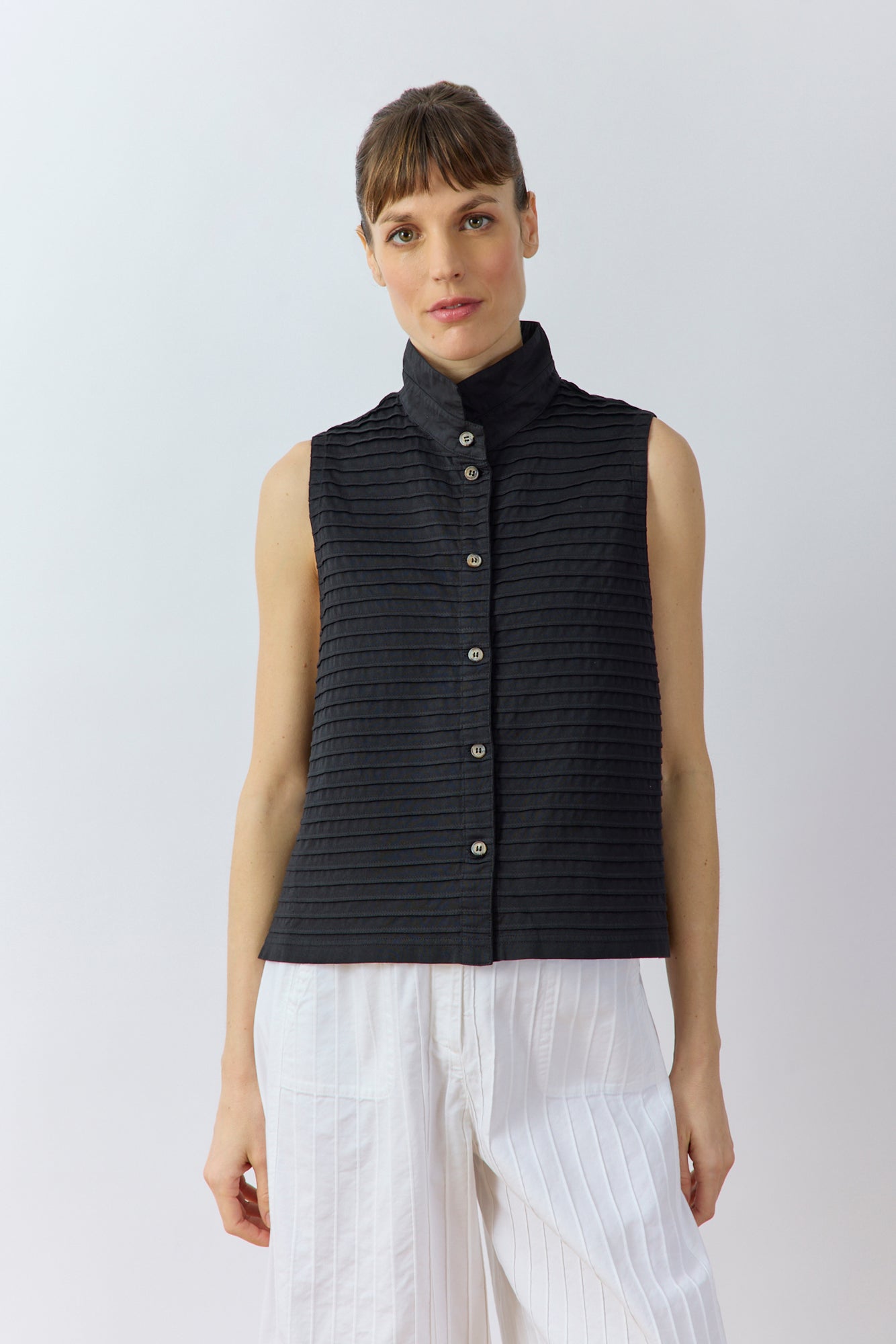 Front view of Kantan Jersey Waistcoat in black by Yaccomaricard, pintucked cotton jersey with stand‑up collar.