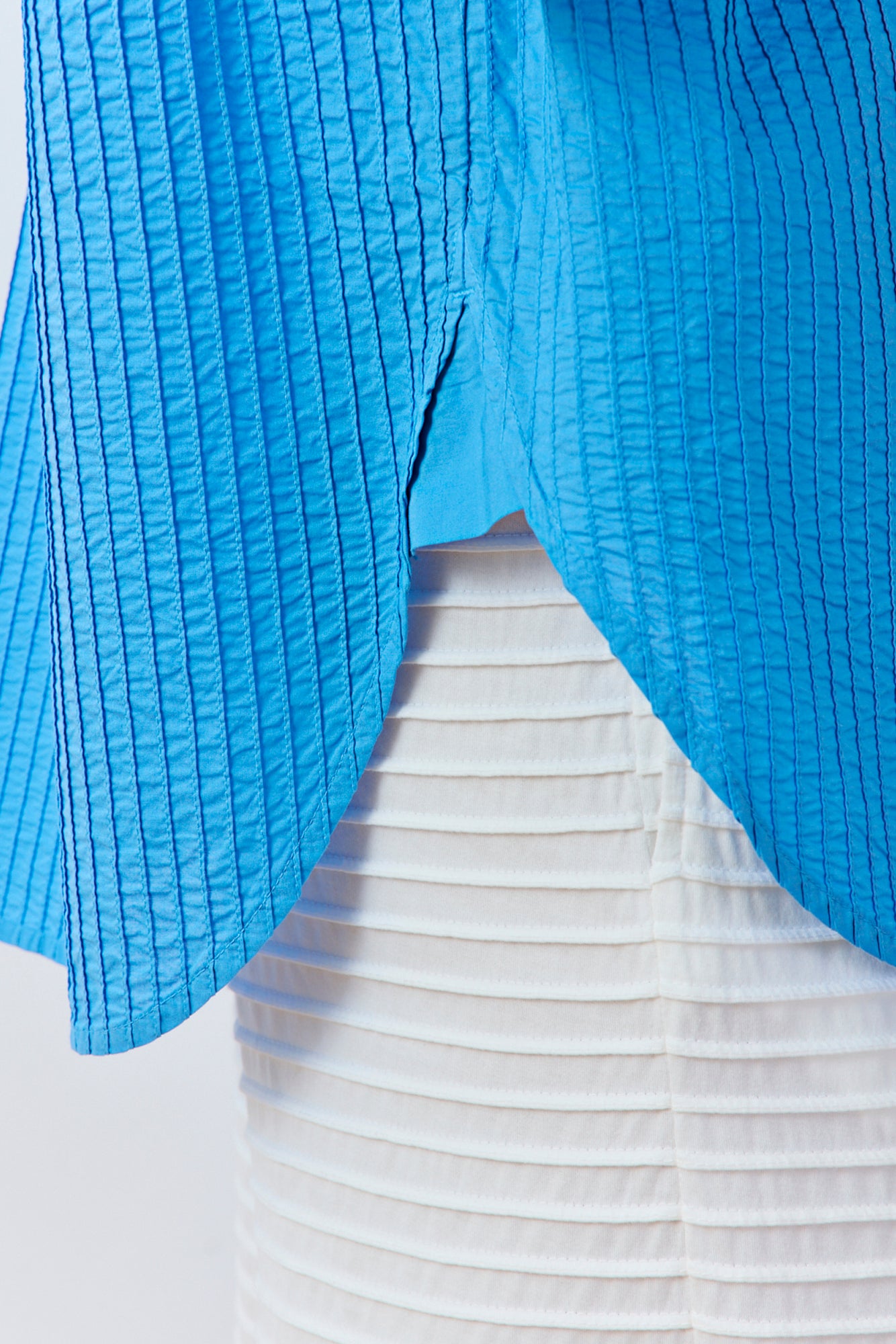 Detail shot of the premium textured cotton and pintuck stitching in Hana Blue.