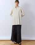 Model wearing Yaccomaricard longline Cotton Jersey Overshirt in Jasmine White – Relaxed Japanese designer styling.