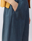 Close-up of the textured cotton muraito and pintuck pockets of the Obaru Trouser.