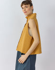 Side profile of the Kantan Jersey Waistcoat in Brown Sugar by Yaccomaricard showing the boxy fit, generous armholes, and side splits.
