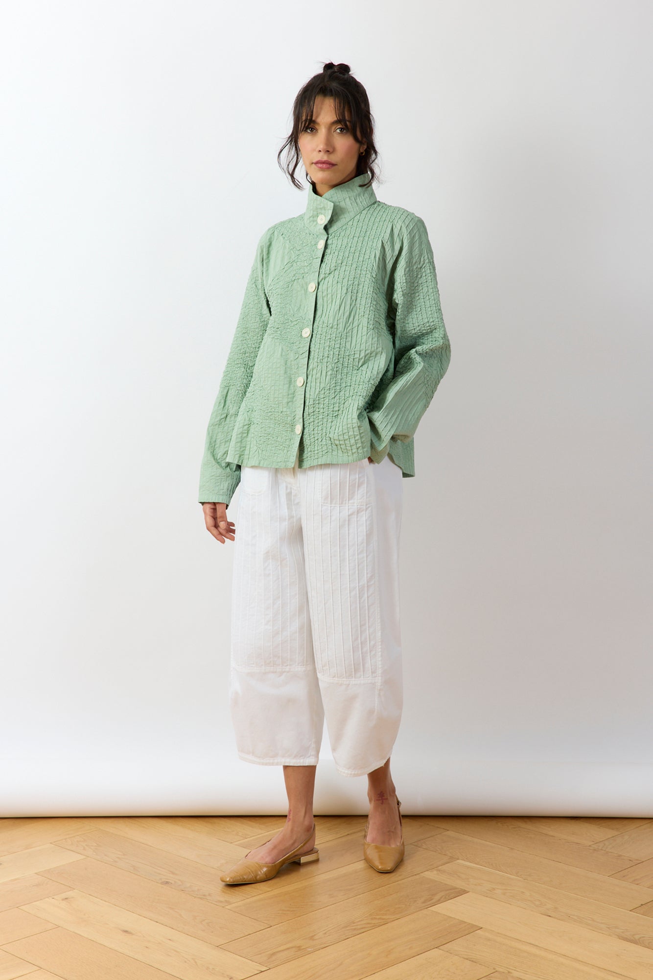 Model wearing Powder Green Shibo Jacket styled over casual outfit showing relaxed shape.