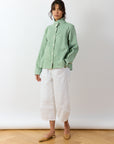 Model wearing Powder Green Shibo Jacket styled over casual outfit showing relaxed shape.