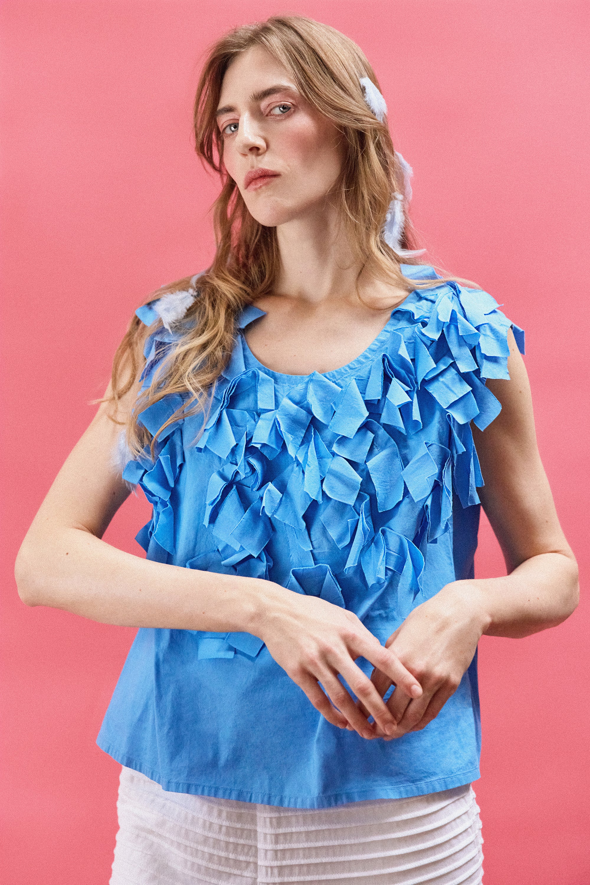 Model wearing Yaccomaricard Hane Vest in Hana Blue – Avant-garde Japanese design.