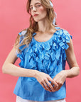 Model wearing Yaccomaricard Hane Vest in Hana Blue – Avant-garde Japanese design.