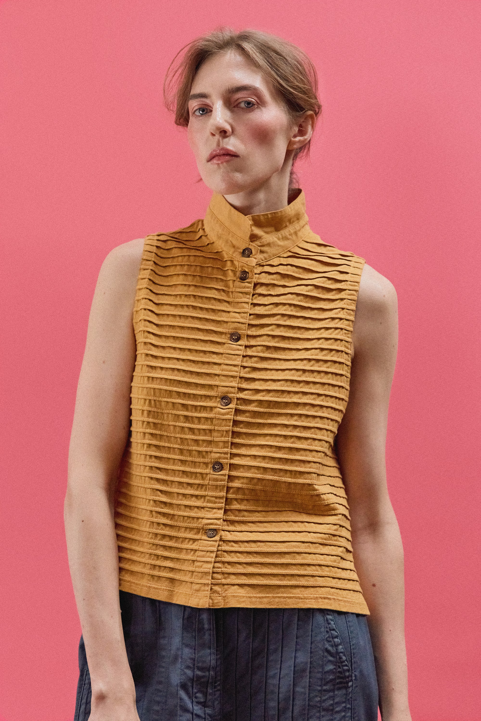 Model wearing Yacco Maricard Kantan Jersey Waistcoat in Brown Sugar – Effortless Japanese designer layering.