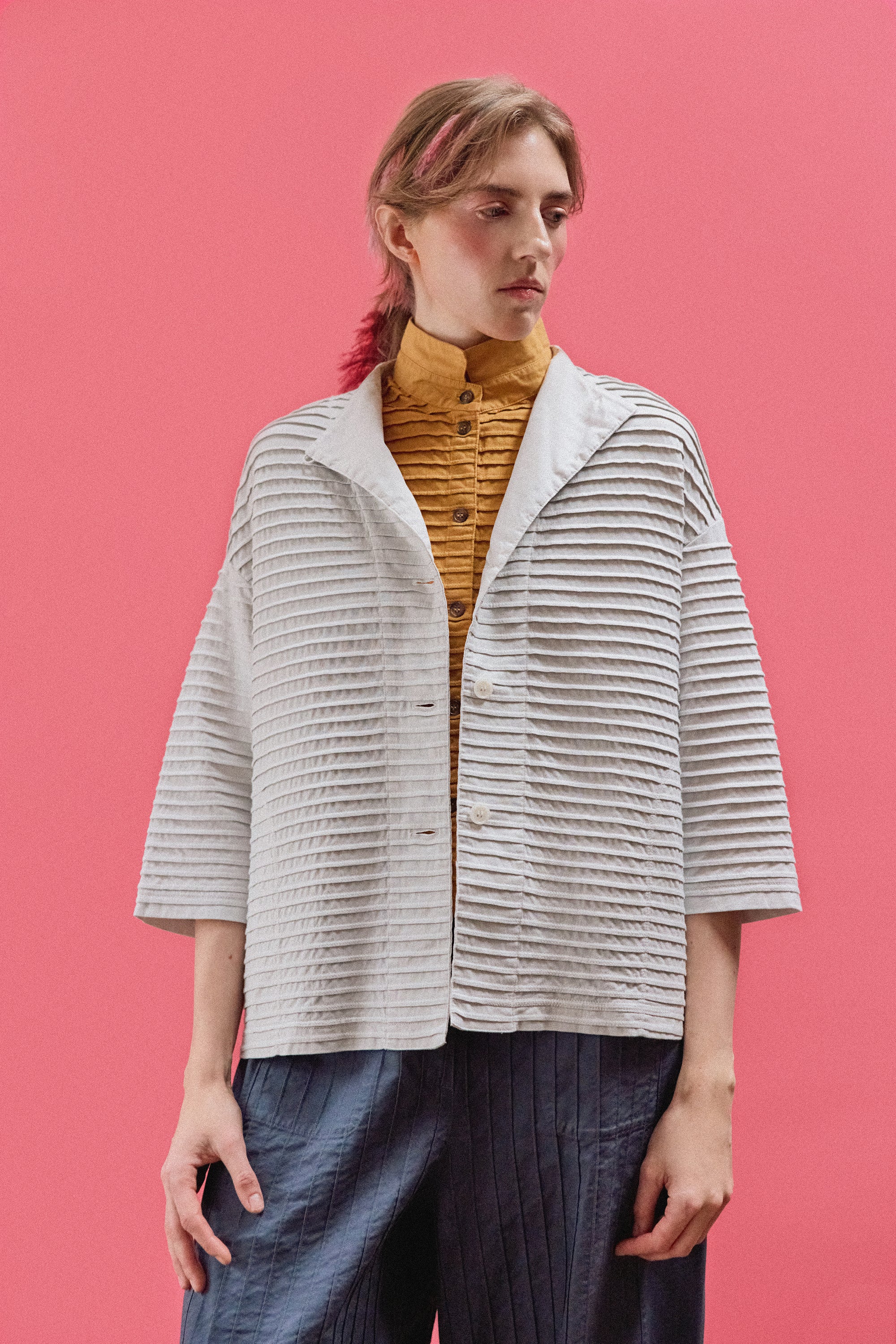 Model wearing Yaccomaricard Faneru Jersey Jacket styled with relaxed contemporary look.