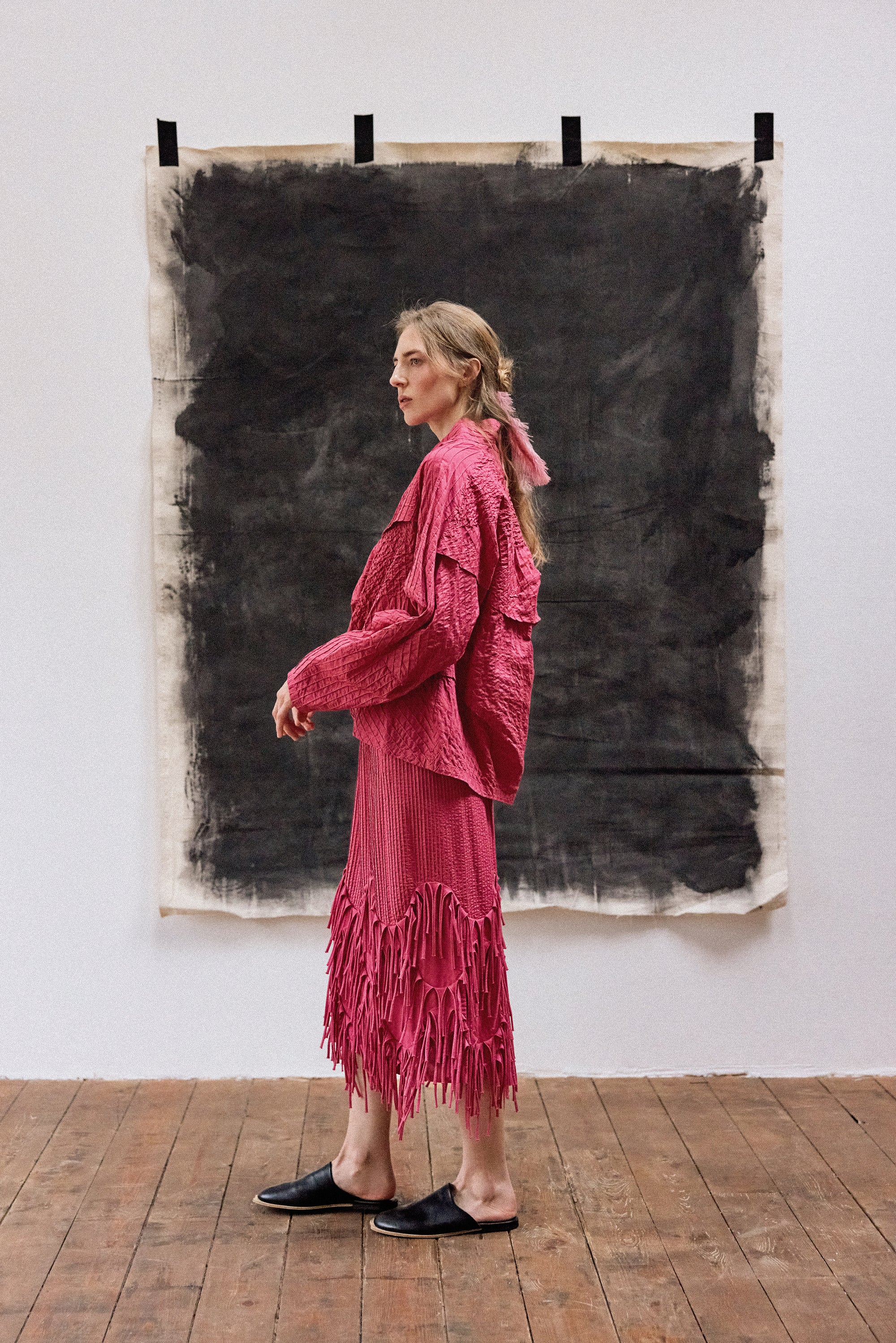 Model wearing Kazari Skirt in Dust Rose styled with minimalist top showing relaxed elegance.