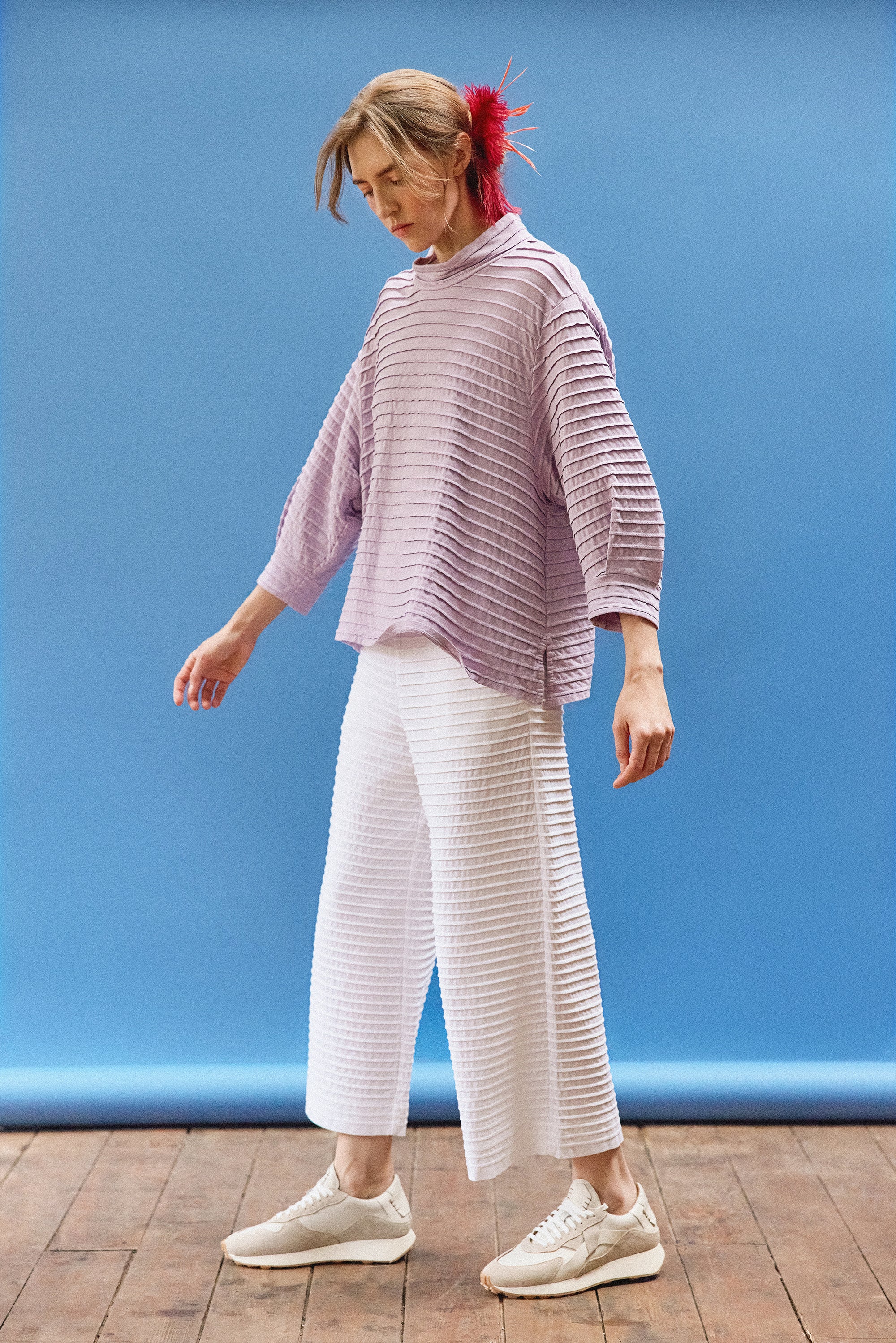 Full length view of the Sode Jersey Pullover in Lilac Purple with a relaxed silhouette.