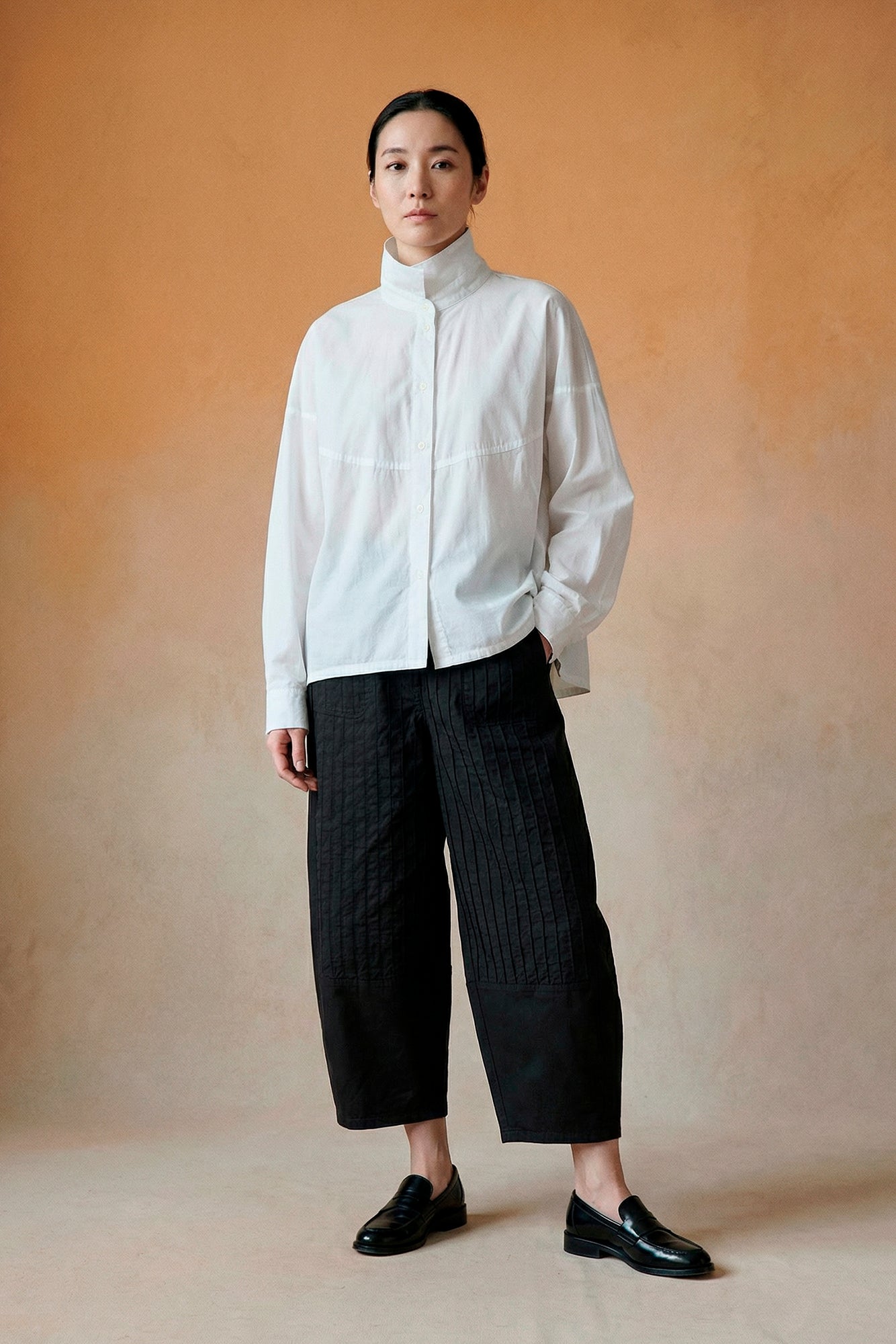Model wearing Yaccomaricard Obaru Trouser in Black – Relaxed Japanese designer styling.
