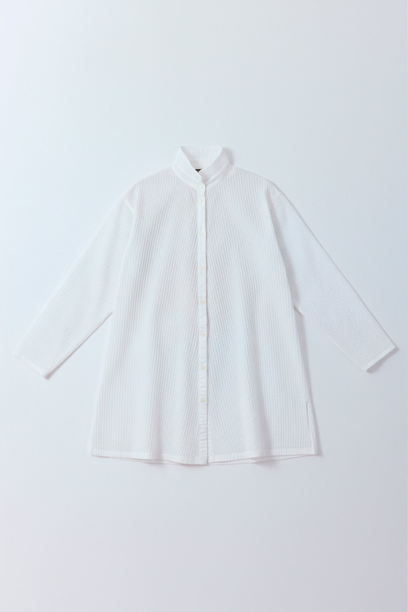 Flat lay of the white classic tunic shirt by Yaccomaricard Spring Summer 26